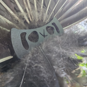 Close up of StrutLock turkey fan holder showing secure feather locking system for display and photography